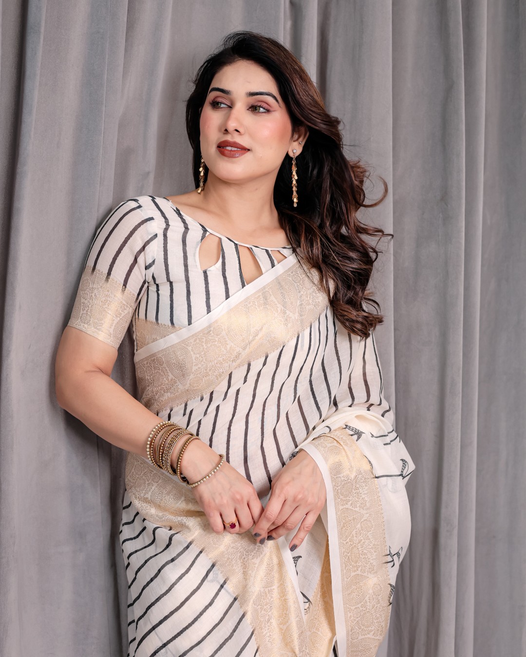 Handloom Linen Saree with Black Vertical Stripes & Tribal Motifs | Golden Zari Border & Tassel Pallu | Attached Blouse | 5.5m Saree + 0.8m Blouse(Pack of 1)