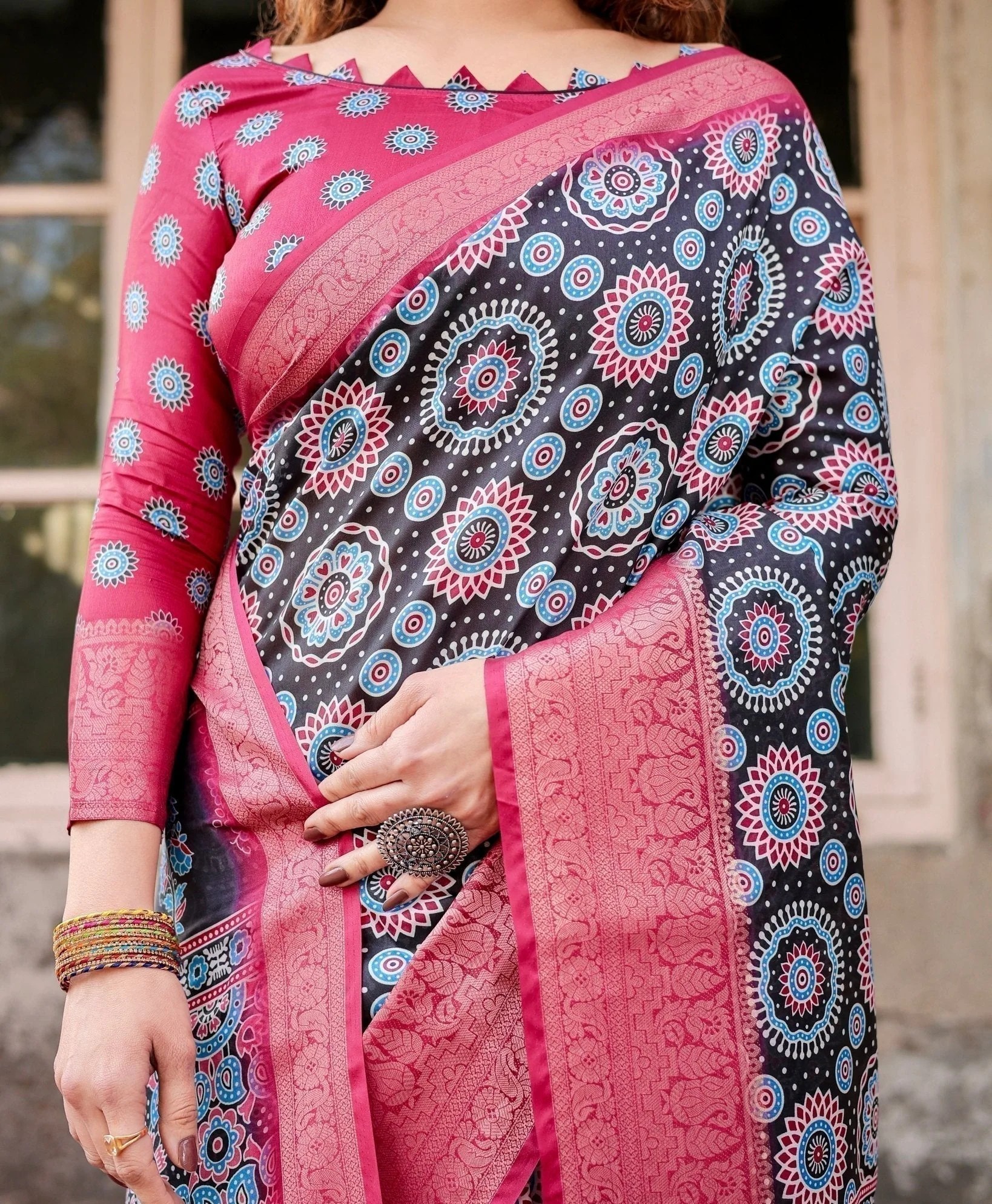 Black and Coral Tussar Silk Saree with Intricate Circular Motifs and Ornamental Pallu (pack of 1)